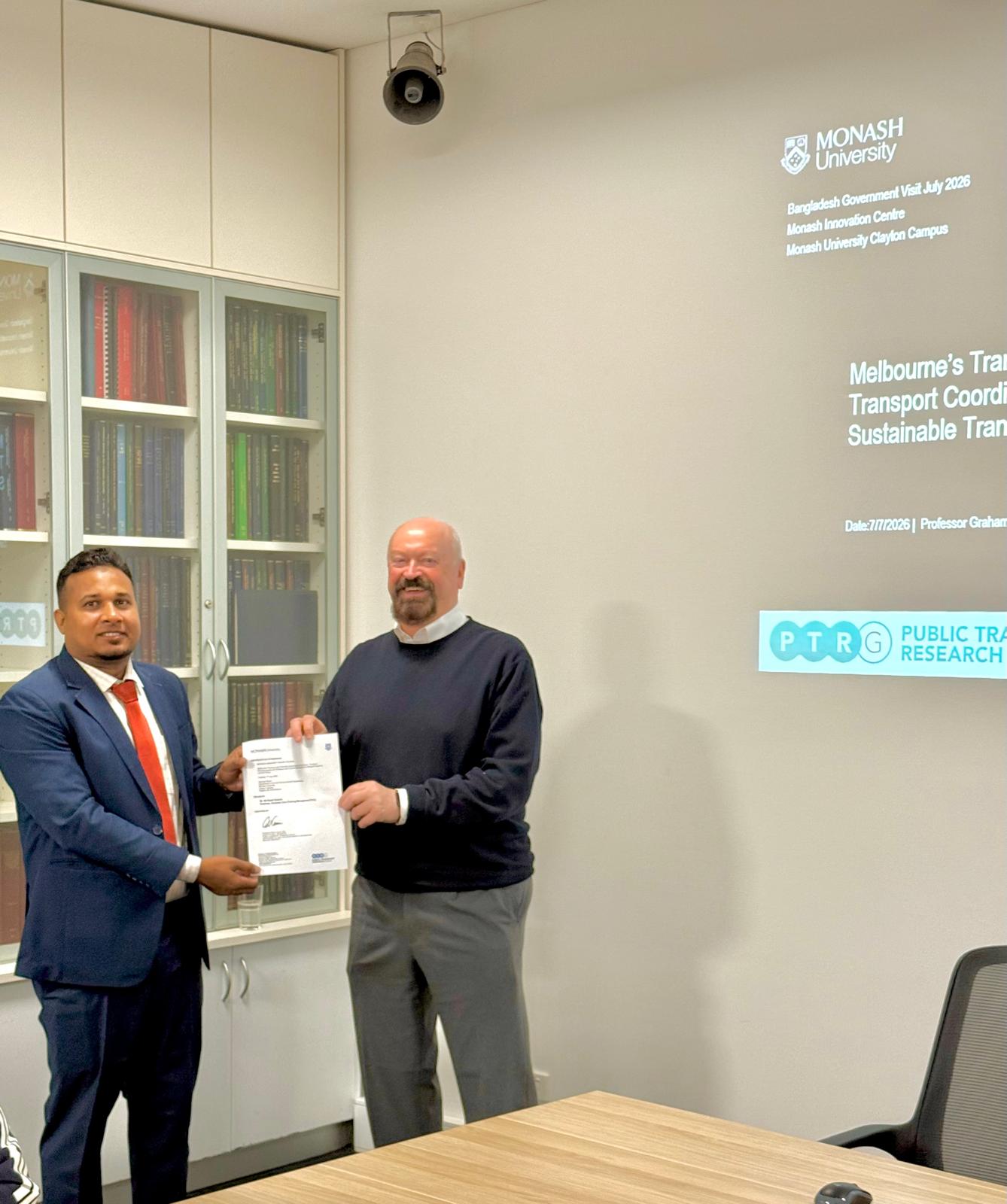 Certificate handover at Monash Innovation Centre — Bangladesh Government Visit July 2026, Public Transport Research Group