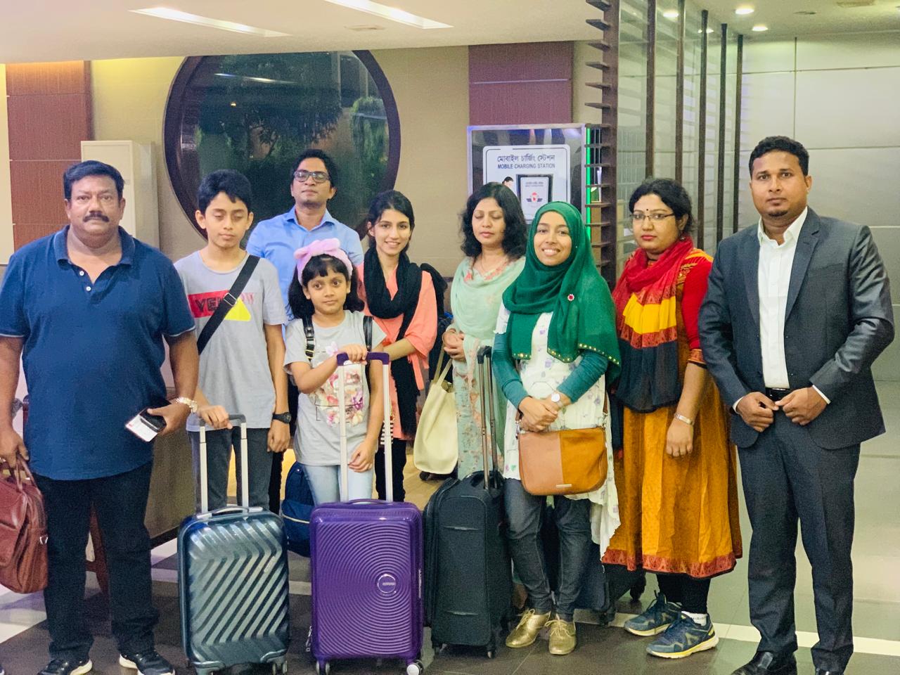 Officer family group at airport before overseas departure