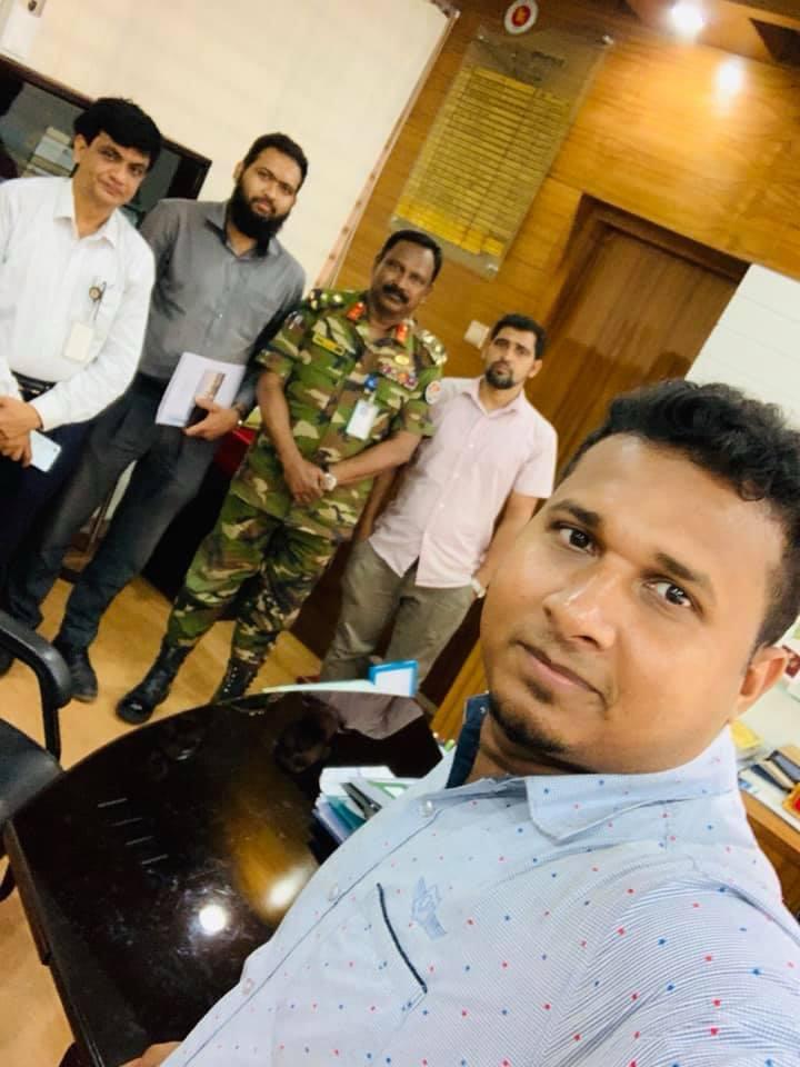 With ministry officials and security personnel after meeting